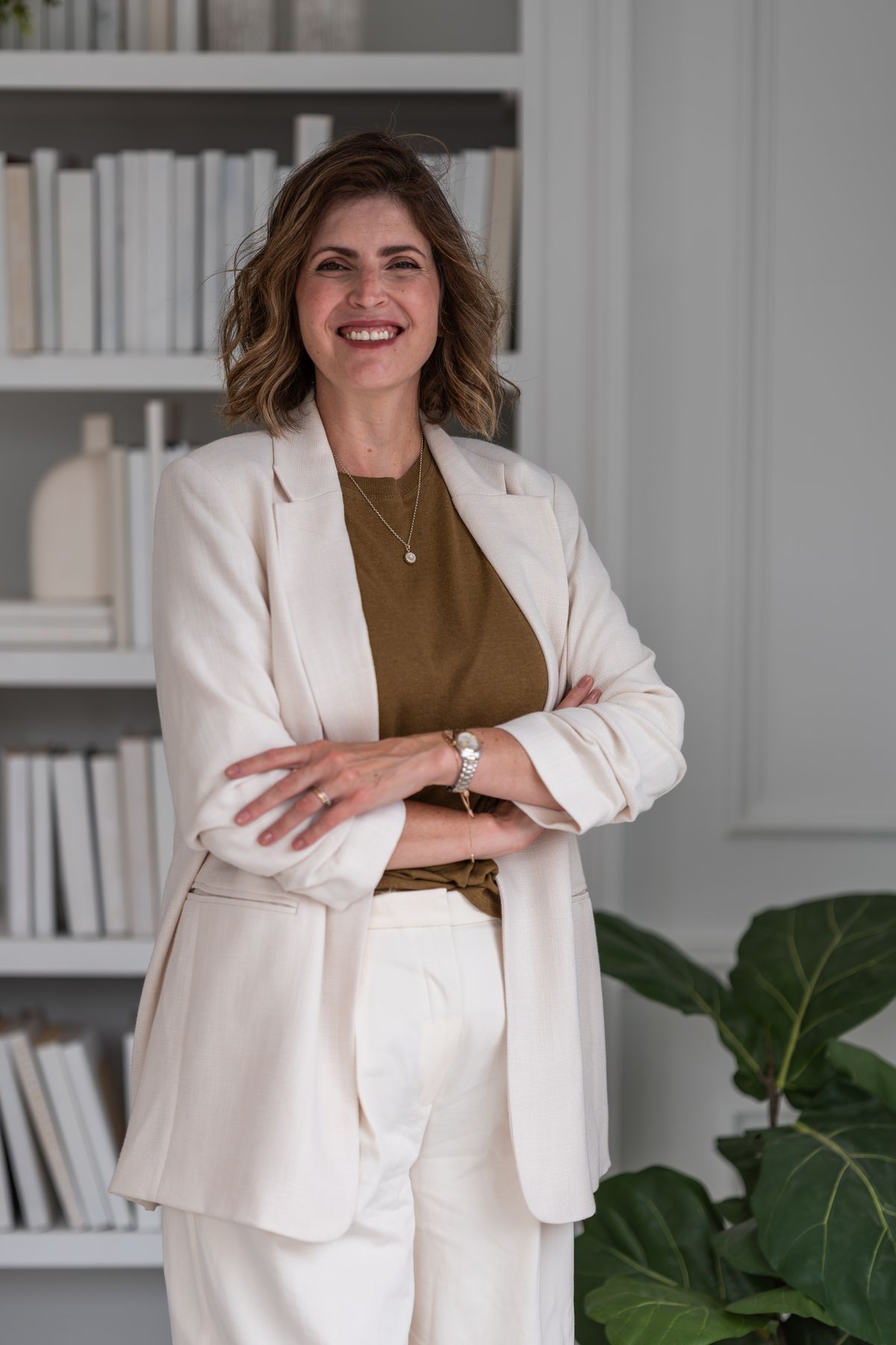 Rebeca Pereira, Registered Psychotherapist (Qualifying), standing in a bright room